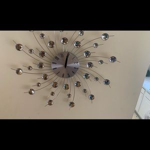 This is a silver crystallized clock.